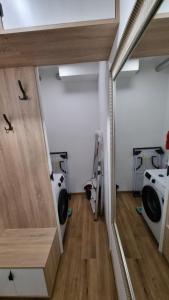 a room with two washer and dryers at Ewa in Reda