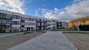 an empty parking lot in front of a building at Ewa in Reda