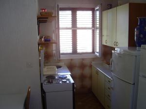 Kuchyň nebo kuchyňský kout v ubytování Petar Apartment
