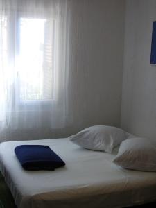 Postel nebo postele na pokoji v ubytování Petar Apartment