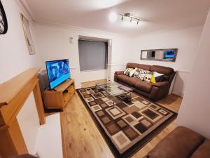 Μια τηλεόραση ή/και κέντρο ψυχαγωγίας στο Manor Place Apartment Thamesmead