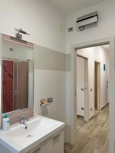 a bathroom with a sink and a mirror at Villa Magiola Pompei in Pompei