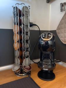 a coffee maker on a table next to a coffeemaker at The Perfect Base to Explore Tuscany - Between Pisa, Lucca, and Florence! - Netflix & YouTube Premium Included in Montecatini Terme