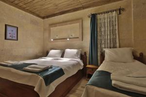 A bed or beds in a room at Cappadocia View Suit