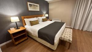 Cama ou camas em um quarto em Hotel Canal Beagle