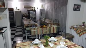a room with tables and chairs in a store at Hotel Bella Unión in Bella Unión
