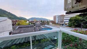 a balcony with a view of a city at Apart Angra dos Reis I in Angra dos Reis