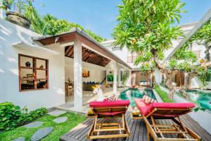 an exterior view of a villa with a swimming pool at Villa Olli with Private Pool in the Heart of Seminyak - Free WI-FI and Netflix in Seminyak