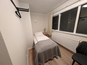 Uma cama ou camas num quarto em The Stykkishólmur Inn by Ourhotels
