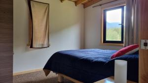 Ένα ή περισσότερα κρεβάτια σε δωμάτιο στο Casa de campo en Llifén