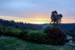 a view of the sunset from a yard at Nunyara - Mountain Views, Rural, Kangaroos, Birds 