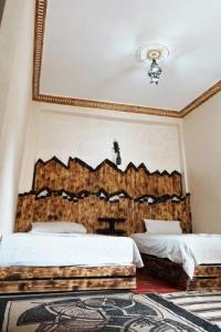 Postel nebo postele na pokoji v ubytování Dounia Hostel