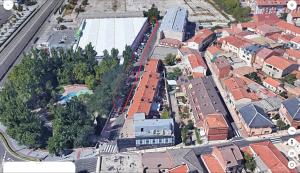 an aerial view of a city with buildings at Hostal NANA B&B in Arroyo de la Encomienda