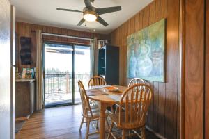 a dining room with a table and chairs and a ceiling fan at Strawberry Townhouse Walk to Leland Snowplay! in Strawberry