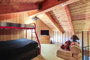 a bedroom with a bunk bed and a teddy bear in a chair at Strawberry Townhouse Walk to Leland Snowplay! in Strawberry