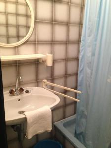 a bathroom with a sink and a mirror at Guest House Alek in Vrboska