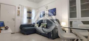 a living room with a couch and a glass table at Alcala' Mendez Home in Alcalá