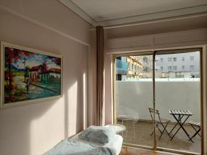 a living room with a painting on the wall at Lisbon`s best at Campo Pequeno in Lisbon