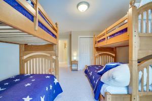 a bedroom with two bunk beds in a house at Ellicottville Townhome with Hot Tub about 2 Mi to Skiing in Ellicottville