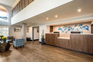 an office lobby with a waiting area with blueprints on the wall at Best Western Inn & Suites Lemoore in Lemoore