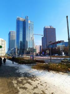 a city with tall buildings in the background at Top Apartamenty Centrum - Rondo ONZ in Warsaw