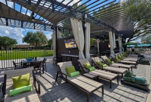 a patio with a bunch of chairs and tables at Hilton Anatole in Dallas