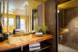 a bathroom with a large sink and a shower at Chalet 1703 - OVO Network in Le Petit-Bornand-lès-Glières