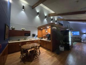 a large kitchen with a table and chairs in it at The Belgium Inn & Suites in Belgium