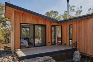 a wooden house with a large wooden deck at Arden Retreat - The Croft at Richmond in Richmond