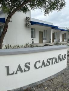 a sign in front of a house with a las casitas sign at Suite 5, Las Castañas in Manglaralto