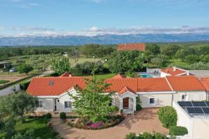an aerial view of a house with red roofs at Luxury villa with a swimming pool Poljica, Zadar - 22070 in Vrsi