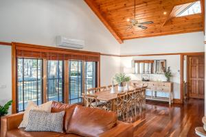 a living room with a table and a couch at Bonvilla Estate in Pokolbin