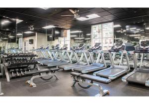 a gym with rows of treadmills and machines at Deluxe 3-BR Condo - Lazy River Summer Fun - Special Offer Now! in Las Vegas