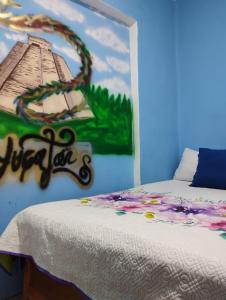 a bedroom with a bed with a painting on the wall at Alo México in Mexico City