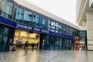 a large building with people walking outside of it at Finsbury Park London Apartment - 10 minutes to central London in London