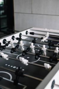 a row of four stove tops with white people on them at NEW Infinity Pool Seaview Urban Suite #2Carparks #2BR in Jelutong