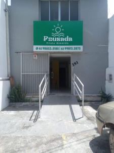 a entrance to a building with a sign on it at Pousada Praia Avenida in Maceió