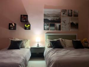 two beds sitting next to each other in a bedroom at KRCB Suite Evo Mall Bangi in Bangi +41 photos