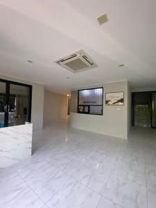 a large room with a large white tile floor at ศิวพฤกษ์ เพลส in Nonthaburi