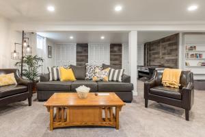 a living room with two couches and a table at Rustic Chic Cottage near Mill Creek, Snohomish, Woodinville in Bothell