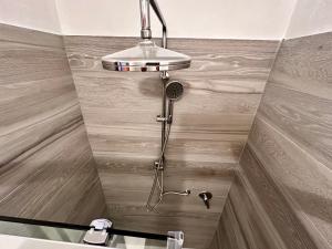 a shower in the corner of a bathroom at Lovely 2 Bedroom in San Gimignano Historic Center in San Gimignano +68 photos