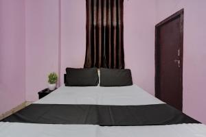 Voodi või voodid majutusasutuse OYO Cozy Home toas