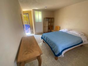 Postel nebo postele na pokoji v ubytování Casa Meraki
