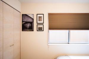 Postel nebo postele na pokoji v ubytování 大吉屋日赤館 名駅そばの一棟貸し