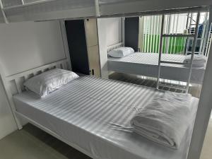Postel nebo postele na pokoji v ubytování PJ Hostel