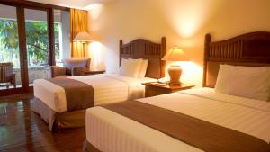Postel nebo postele na pokoji v ubytování Lorin Solo Hotel