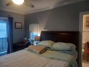 a bedroom with a bed with a pillow on it at WaterfrontHome-RiverView, Windsor ,Canada in Windsor