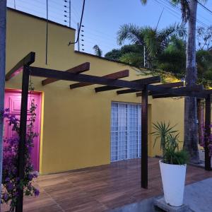 a wooden pergola in front of a house at CASA IMPERIAL HOTEL POUSADA in São Luís +24 photos
