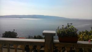a view of the water from a balcony at Apartment and Rooms Busa 3 in Senj