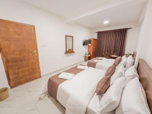 מיטה או מיטות בחדר ב-The Mount View Single Tree Hotel